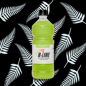 Bright green lemon-and-lime electrolyte drink in a plastic bottle against a black fern-pattern background; label reads 'B-LINE' and 'MAKES 10 LITRES'